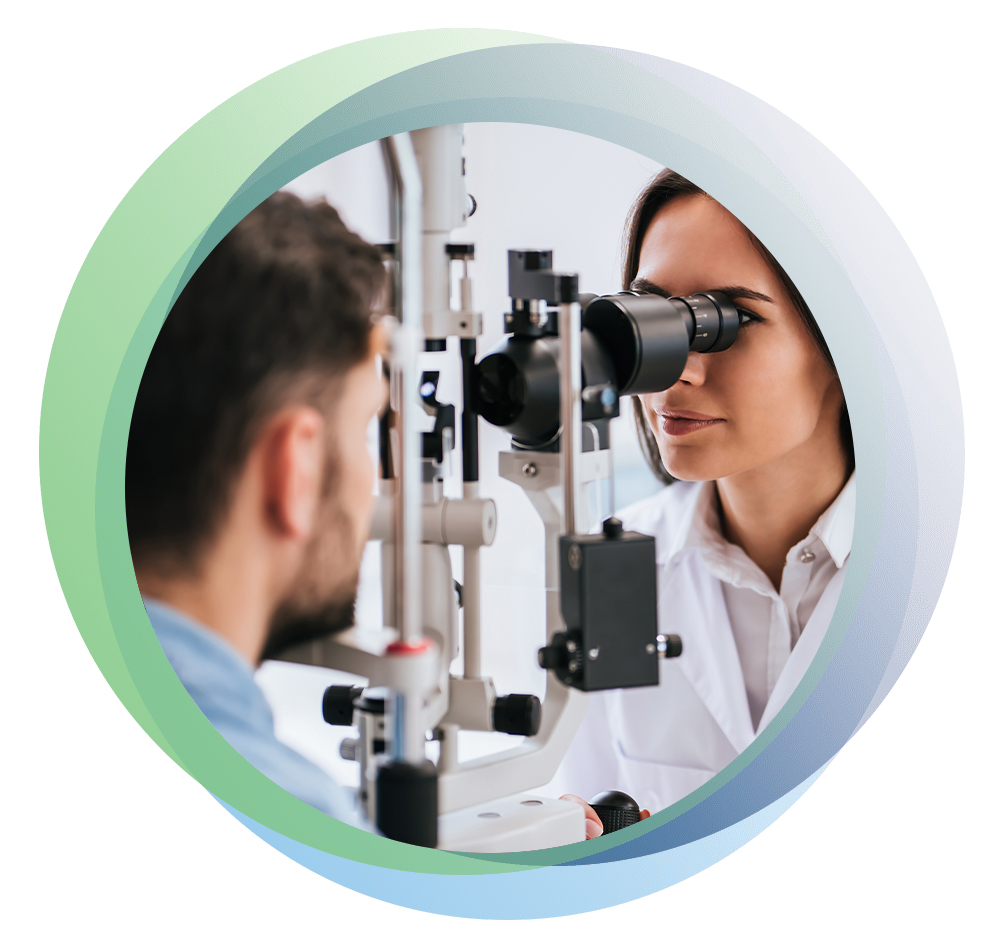 optometrist examining patient's eyes